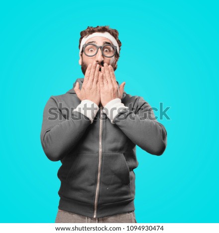young crazy, bearded and expressive sports man gesturing emotion and signs isolated against monochrome background