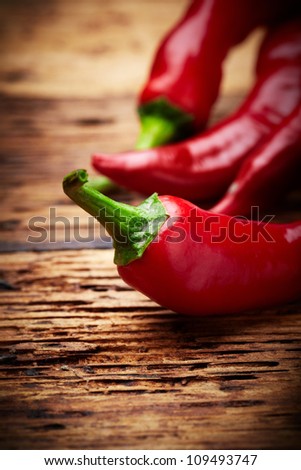 some chili peppers on a table Royalty-Free Stock Photo #109493747