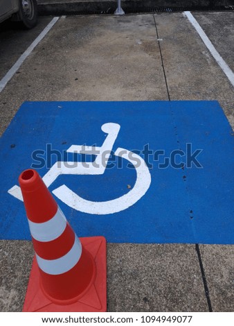 Handicapped parking. Symbol of handicapped on  the  concrete line parking.