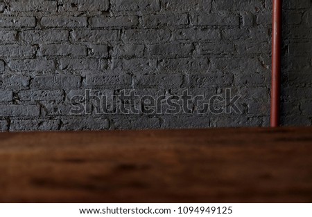 Empty top of wooden table or counter isolated on rustic focus wall brick Texture background. For product display