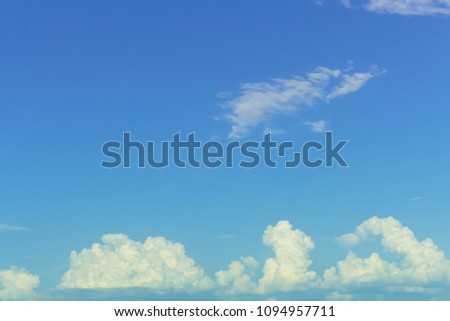 Bright light on low clouds in blank blue sky