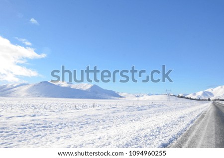 The winter snowy road from Lake Tekapo to Christchurch.You’ll pass through several towns and along farmland, and as you get closer to Tekapo, the scenery will start to become mountainous.