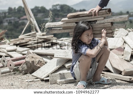 Children are forced to work construction., Violence children and trafficking concept,Anti-child labor, Rights Day on December 10. Royalty-Free Stock Photo #1094962277