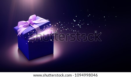 Blue open gift box with magical light Royalty-Free Stock Photo #1094998046