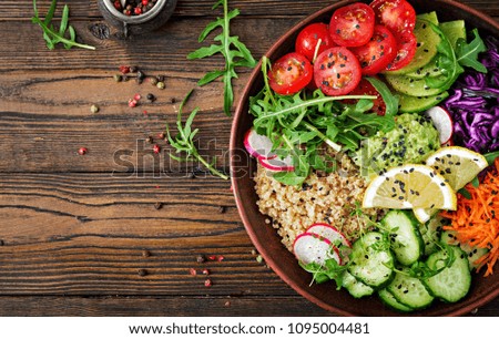 Vegetarian Buddha bowl with quinoa and fresh vegetables. Healthy food concept. Vegan salad. Top view. Flat lay