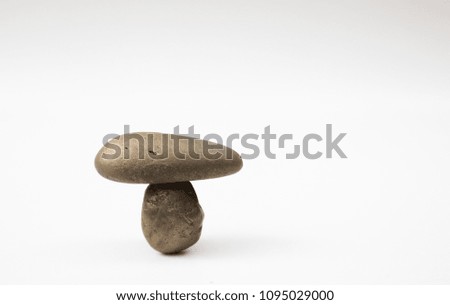 Balance different stone concepts together on a white background.