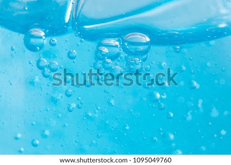 Shampoo closeup - Bubbles on blue background 