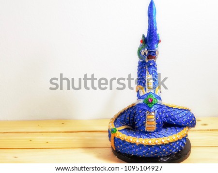Serpent king of naga blue on table brown and white background