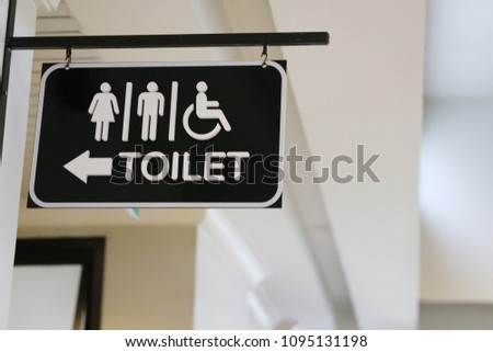 set of toilet icon include women, men and handicap WC hanging signs for restroom.Restroom sign on a toilet.