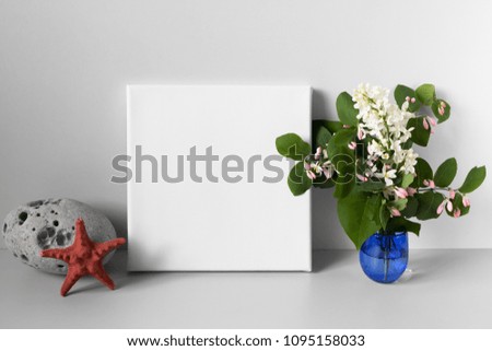 Mock-up poster. White canvas and flowers. Summer concept. Copy space for text on canvas.

