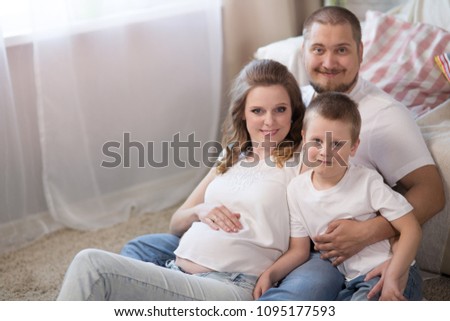 Family with a child of five years and a pregnant mother 