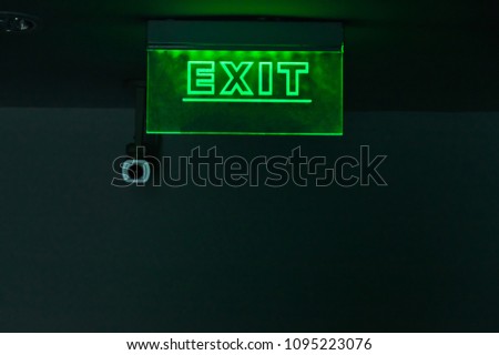 Light signs, installed on the corridor in the hotel. Tell the emergency exit