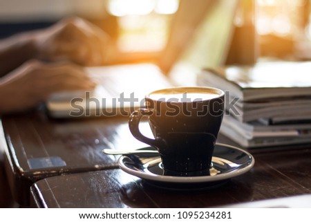 Good morning coffee during work on laptop 