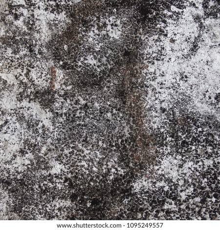 Surface of white wall with black abstract pattern of old wall