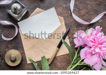 card mockup with peonies, ink pen, craft environment