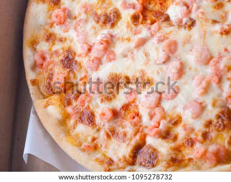 Pizza with shrimps in a box