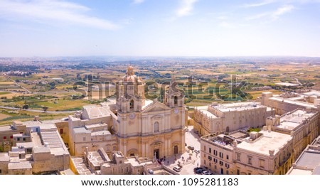 Aerial view of the fortified capital city of Malta, The Silent City, Mdina or L-Imdina, skyline against blue Spring skies with huge walls, cathedral domes and towers.