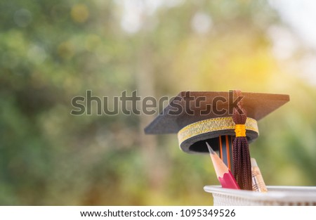 Graduate study or Education knowledge is power concept: Graduated cap Put on color pencil in basket. Conceptual for Educational is successs study or business world. Back to School ideas. Royalty-Free Stock Photo #1095349526