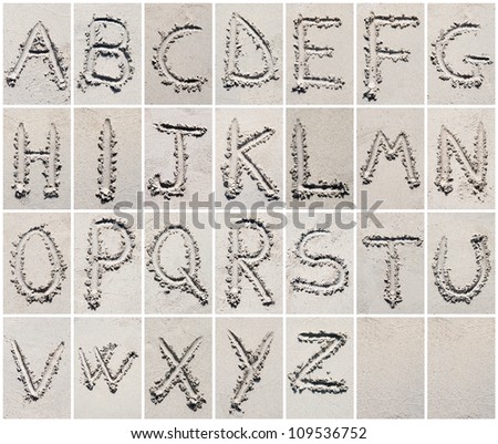 Alphabet letters writing on the sand beach