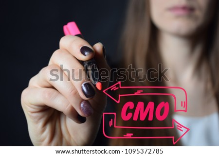 Businessman writes a red marker inscription:CMO