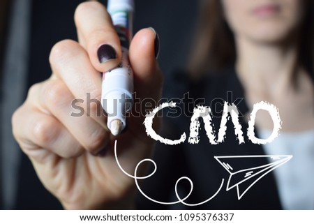 The businessman writes an inscription with a white marker:CMO