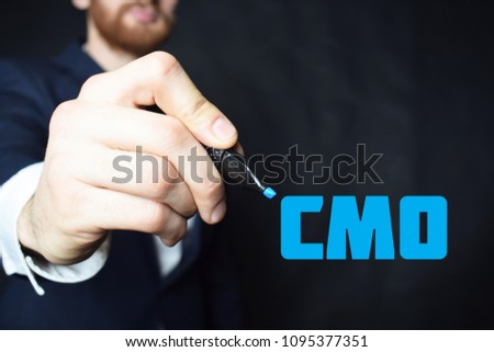 The businessman writes a blue marker inscription:CMO