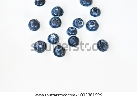 Blueberries swim in milk
