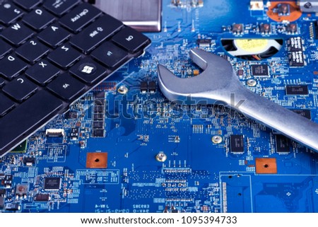 Wrench on the processor board.Computer repair concept.Close up view.