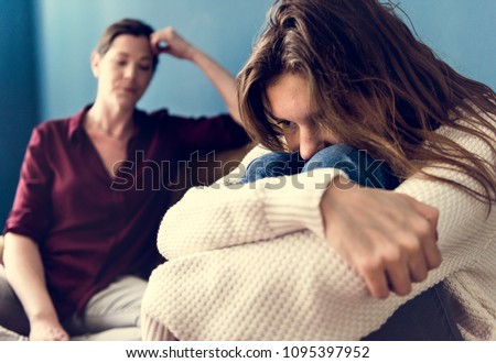 Mother and teenage daughter having an arguument Royalty-Free Stock Photo #1095397952