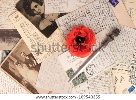 old photos and post cards with letter opener. vintage grunge background