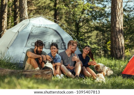 Group of friends camping in the woods