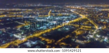 Blurred city lights bokeh. Aerial view urban night light bokeh. 