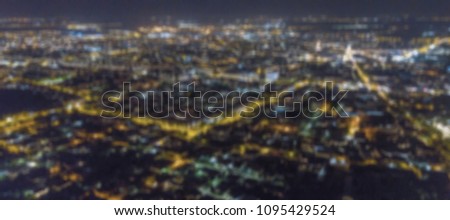 Blurred city lights bokeh. Aerial view urban night light bokeh. 