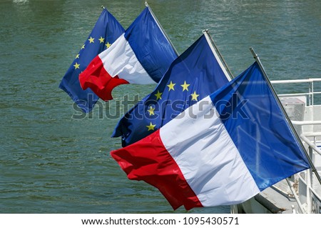 European Union Flag and French Flag on Seine river