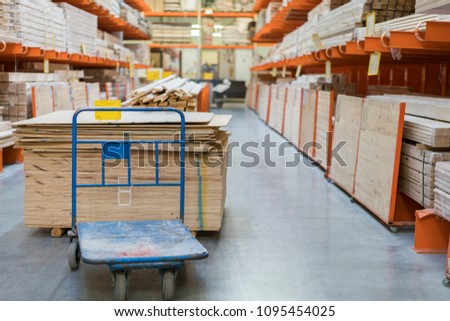 shop of building materials. Racks with boards, wood and building materials. Packed boards in the building store. dry flat boards stacked together. close-up. building materials
