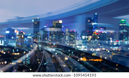 City downtown blurred bokeh light over train track motion double exposure, abstract background