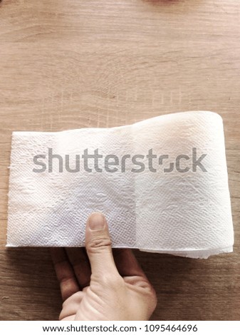
 
White 
toilet paper Handle on wodden tabel