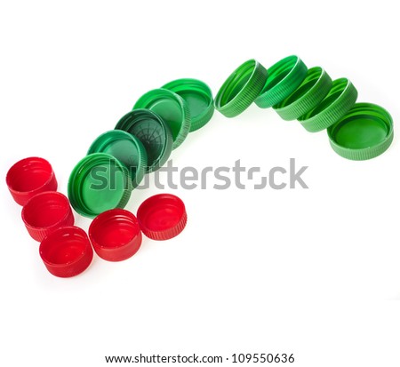 arrow of color plastic bottle caps isolated on white