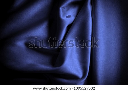 Texture, background, pattern. Silk fabric dark blue lilac. this is a heavy, complex silk fabric, similar to texture, and ends with a strong business. It is slightly heavier and opaque than chiffon. 
