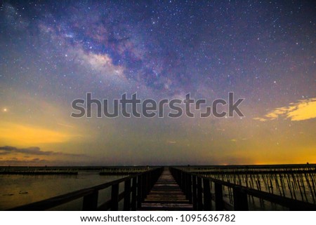 Milky way on the sky at bridge view point of the sea