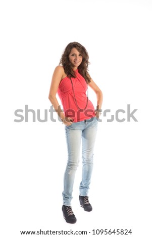 Full length portrait of a beautiful brunette wearing casual clothing on white background