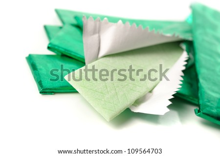 chewing gum and the wrapping foil on white Royalty-Free Stock Photo #109564703