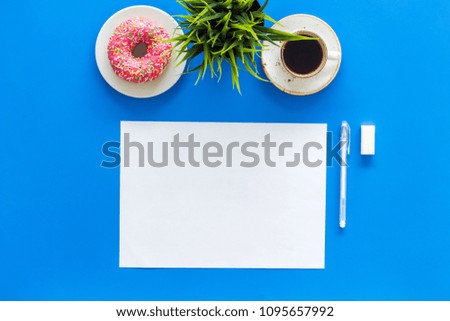Come up with brand identity. Blank stationery for branding near coffee and donut on blue background top view mockup pattern