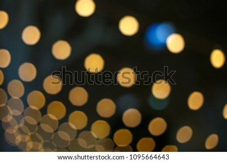 blurred background, bright bokeh from light bulbs