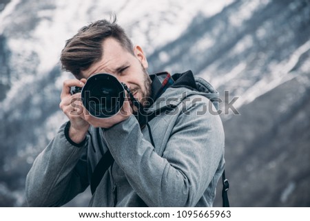 High end camera user.  Camera operator. Photographing the photographer. Royalty-Free Stock Photo #1095665963