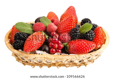 still life of  heap multi-coloured  berrys in  basket, on white background, isolated