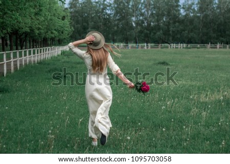 girl with flowers in the field
