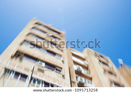 Abstract motion blur effect. City on a sunny day