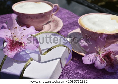  Still life with blossom and shaped gift box. Coffee with a gift and flowers. 