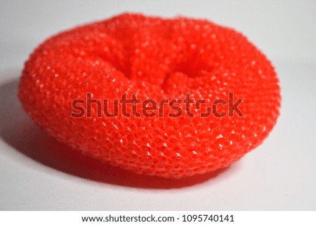 Colorful Red Sponge With Scratchy Texture On White Background